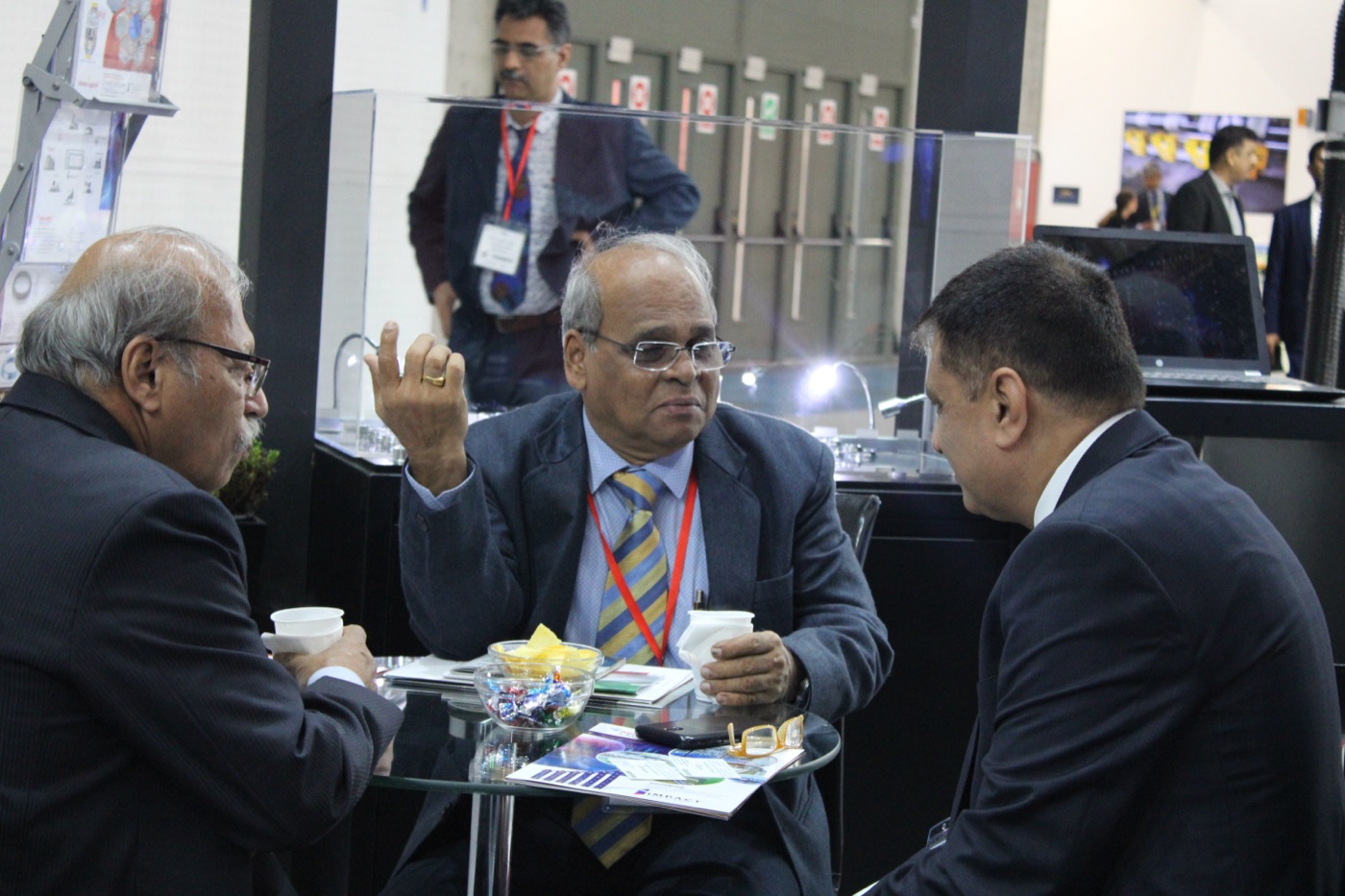 Innospin in discussion with mill representatives at an exhibition