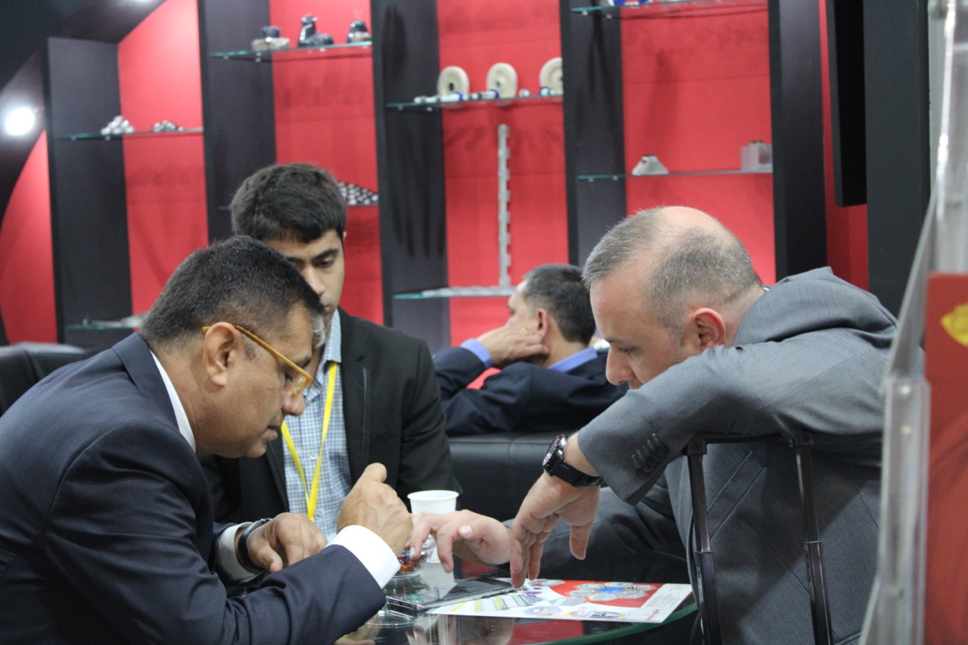 A mill team talking with Innospin at a textile exhibition